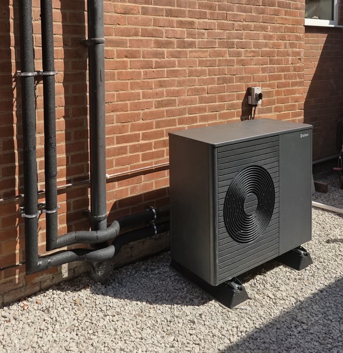 Vaillant air source heat pump installation on a brick wall, Reading