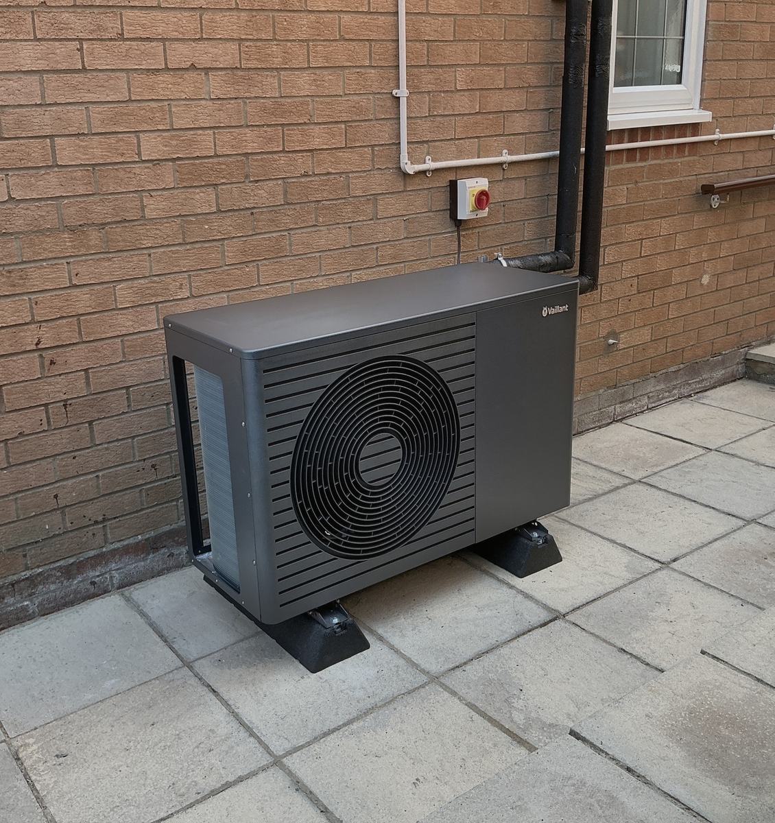 Vaillant air source heat pump installation on paved patio, Reading